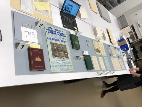 Layout planning photo of all items to be included in the third section of the north table case on the ground floor of the Beinecke Library. 