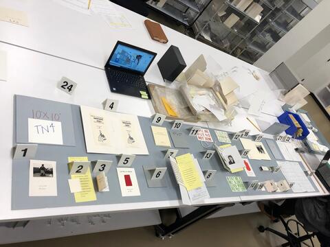 Layout planning photo of all items to be included in the fourth section of the north table case on the ground floor of the Beinecke Library. 