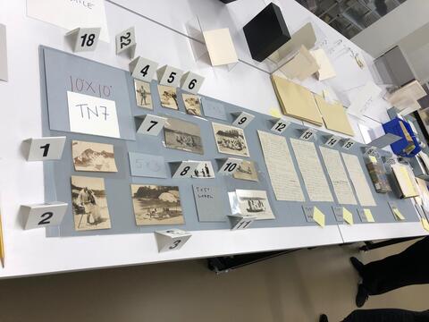 Layout planning photo of all items to be included in the seventh section of the north table case on the ground floor of the Beinecke Library. 