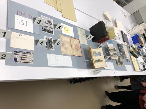 Layout planning photo of all items to be included in the first section of the south table case on the ground floor of the Beinecke Library. 