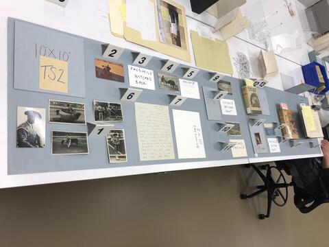 Layout planning photo of all items to be included in the second section of the south table case on the ground floor of the Beinecke Library.