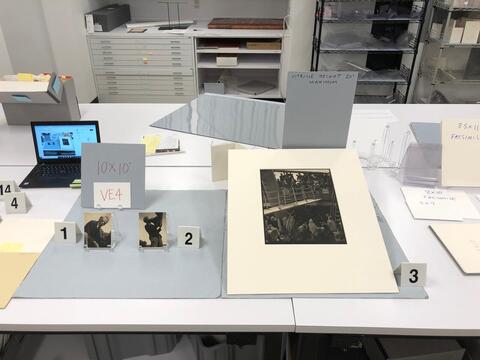 Layout planning photo of all items to be included in the fourth vintrine case on the east side of the Beinecke Library. 